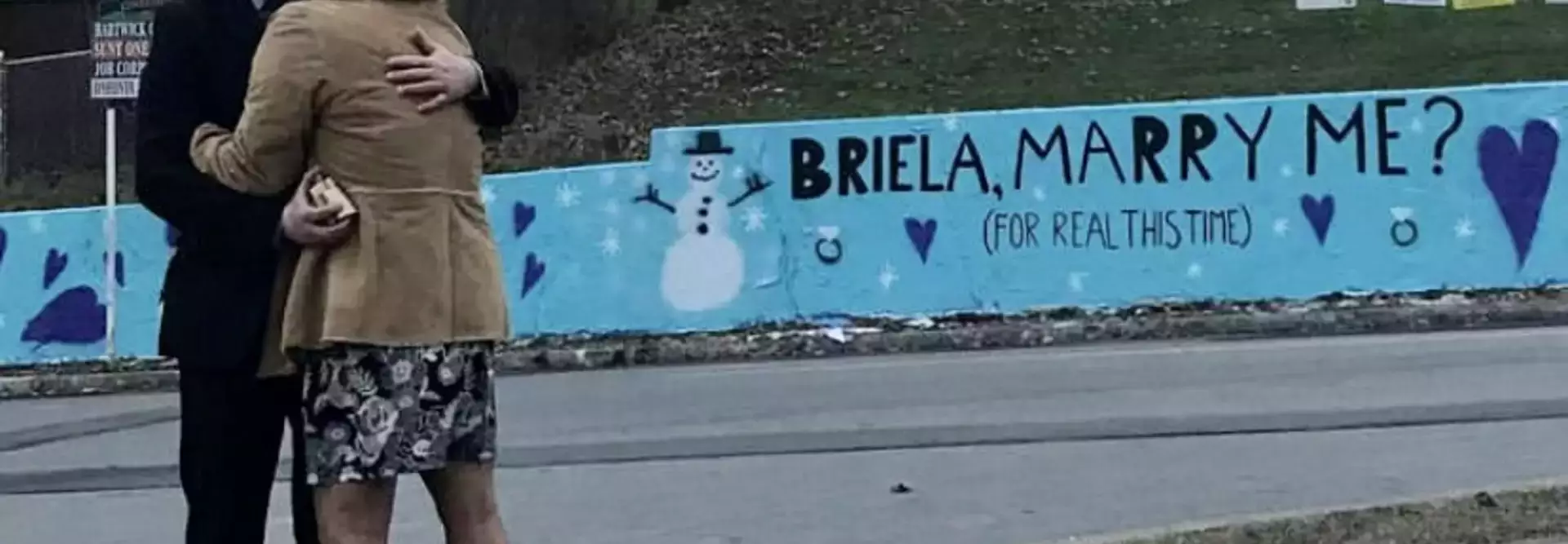 Alumnus Uses Oneonta Wall to Pop the Question
