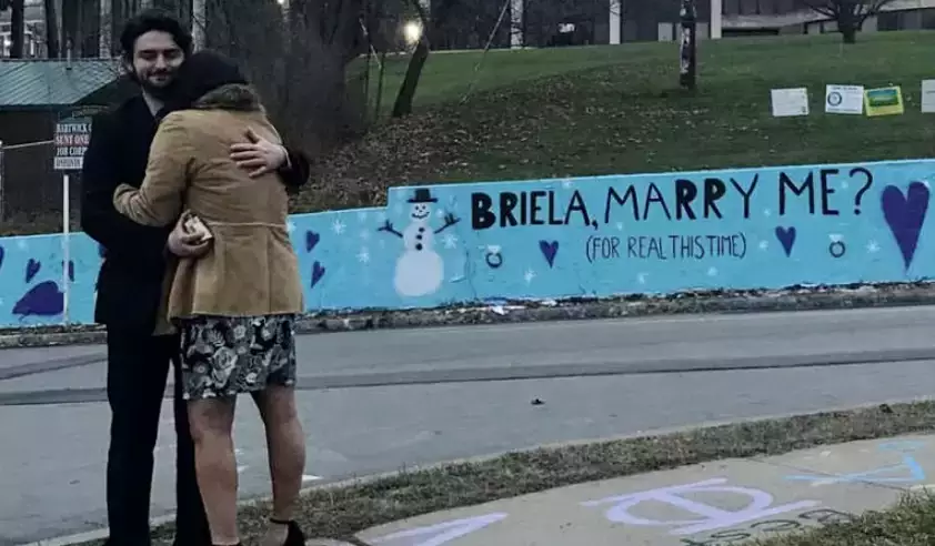 Alumnus Uses Oneonta Wall to Pop the Question