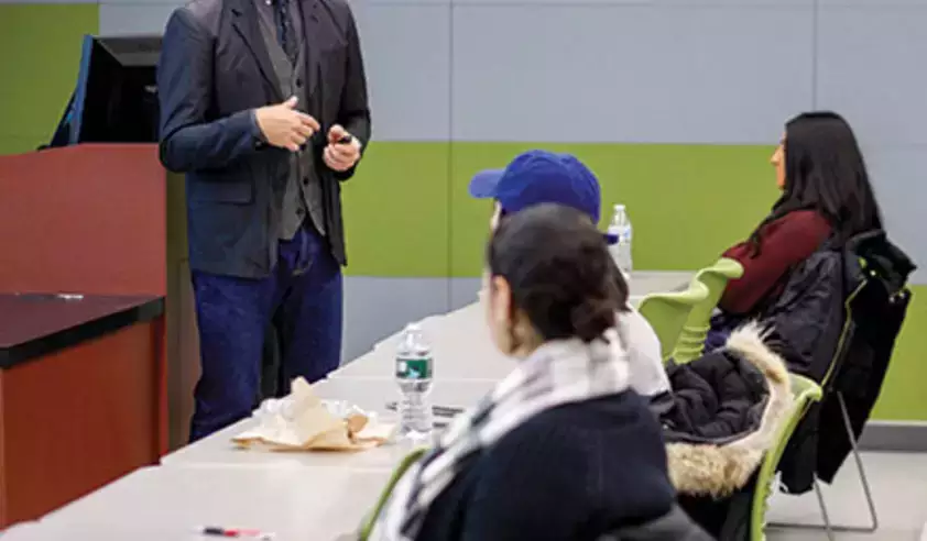Scott Saltzman speaks to a fashion class