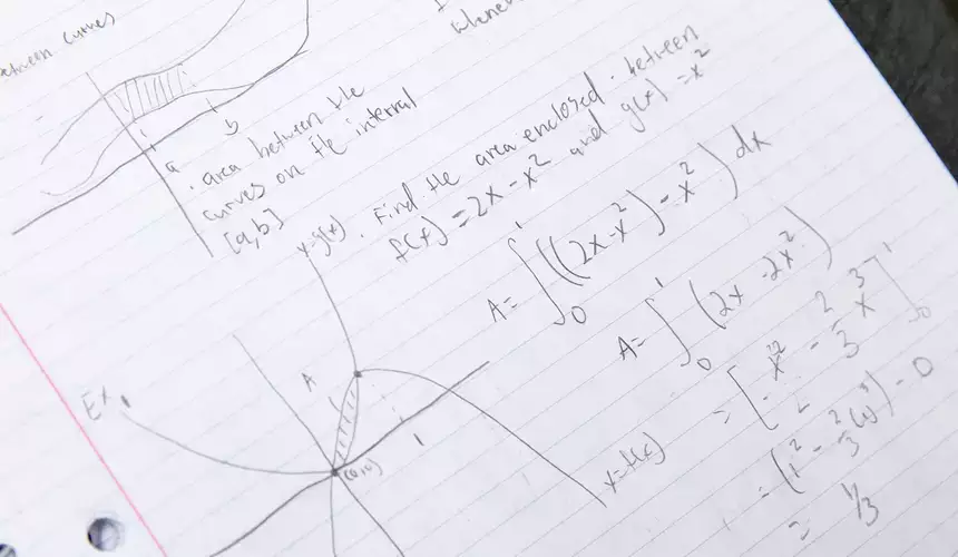 Calculus notes showing graphing and functions.