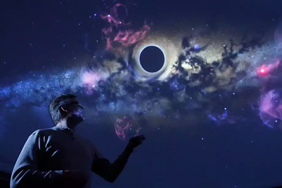In the Planetarium at SUNY Oneonta, assistant professor of physics & astronomy Josh Nollenberg