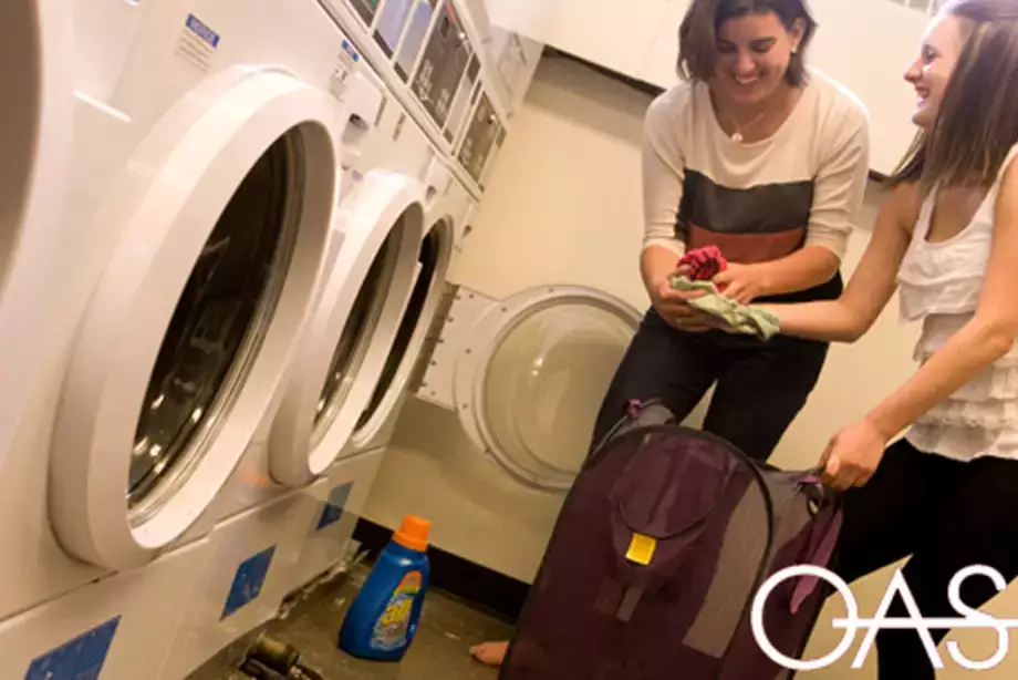 Two students enjoying doing laundry together
