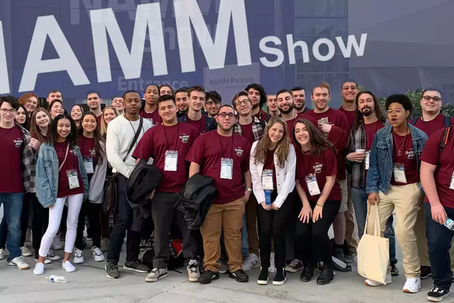 Students in front of NAMM Show sign