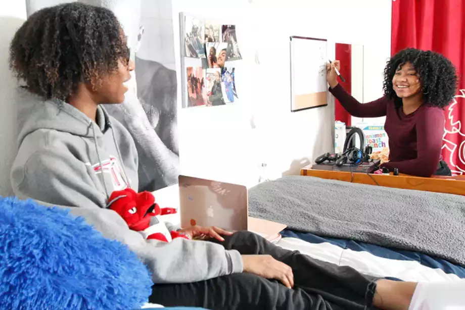 Students studying together in their dorm.