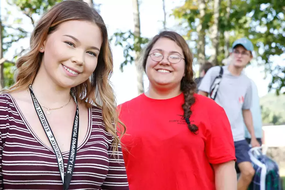 Volunteer students helping new students move in.