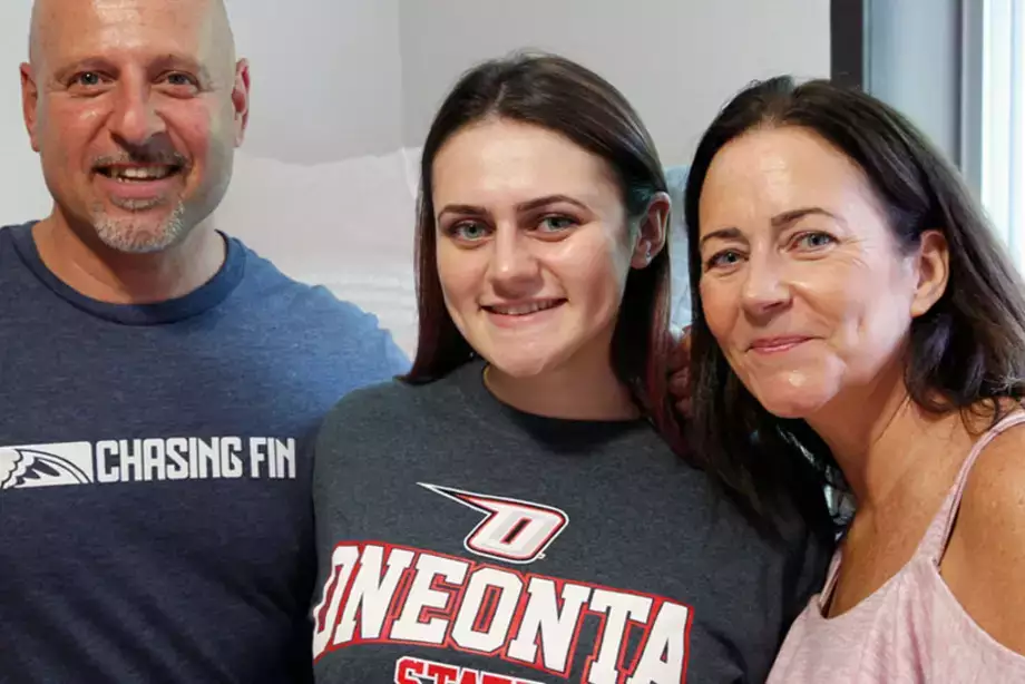 Mother and father helping their daughter move into her new dorm.
