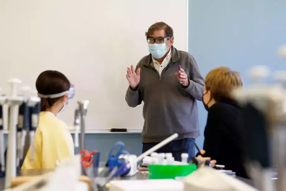 Professor working with students