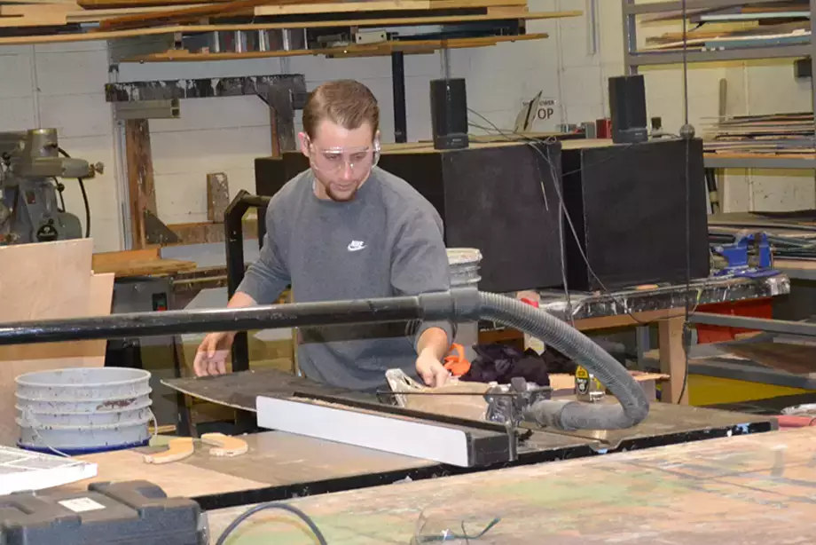 A student works in the scene shop at SUNY Oneonta