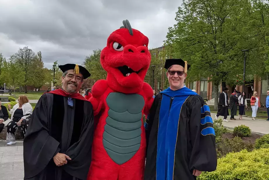 Dr. Leon and Dr. Hendley with the Red Dragon mascot