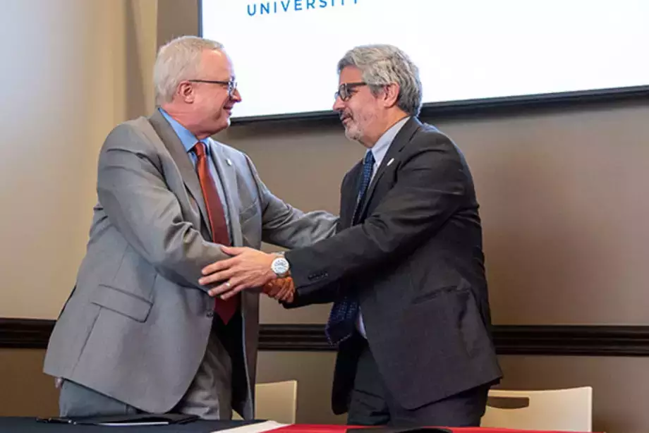 Nursing Student Pathway with Utica University Shaking Hands