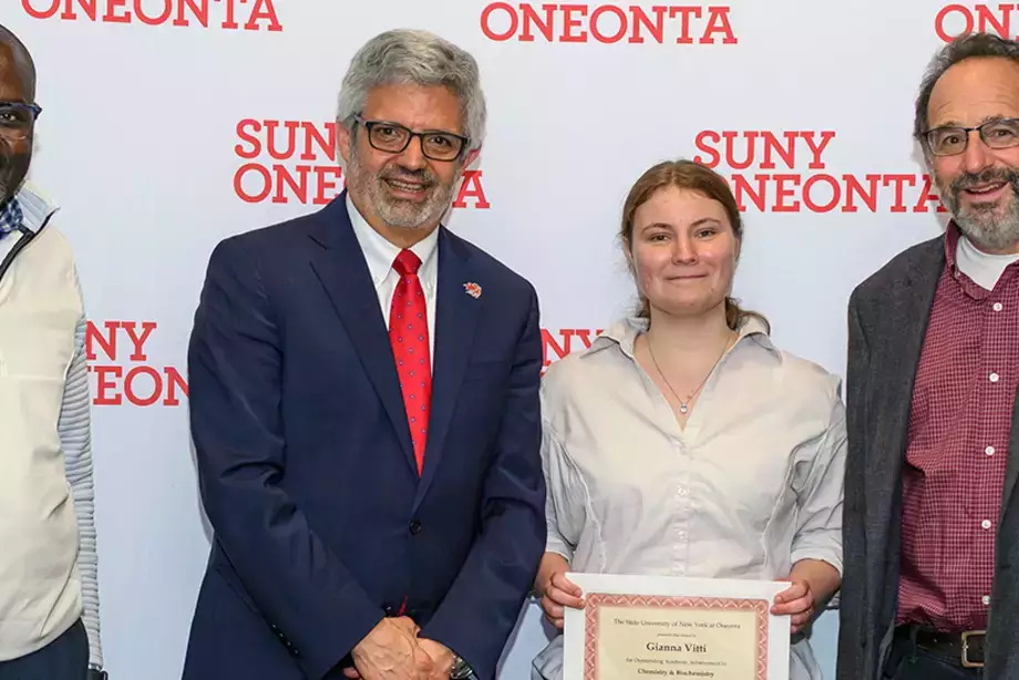 Dr. Maurice Odago, President Alberto Cardelle, Gianna Vitti, and Dr. William Vining at the 2025 Academic Achievement awards ceremony