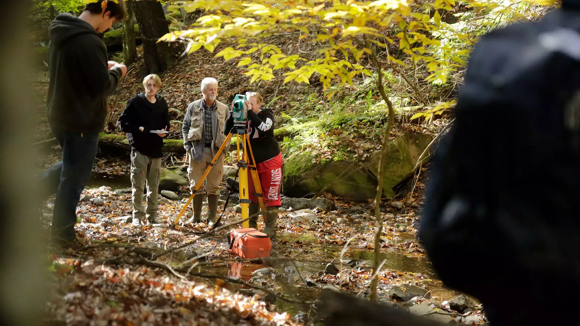 Students learn geoscience mapping techniques in the field.