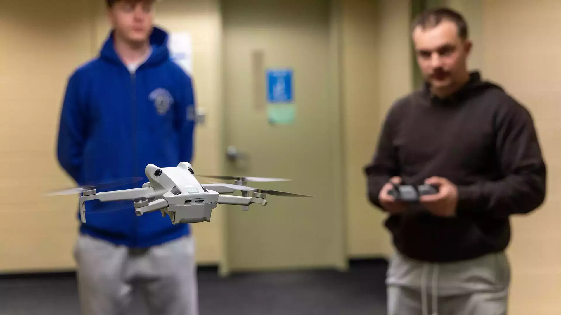 Students practice with a drone during UAV operations class