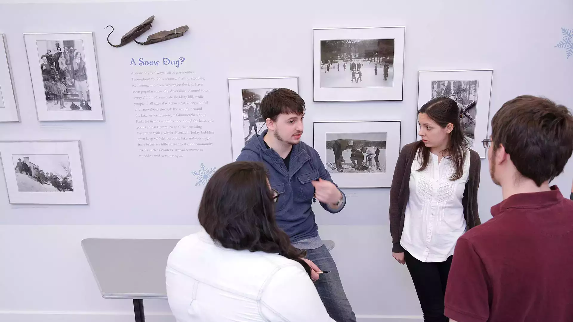 Museum Studies students discuss their exhibit designs during a critique.