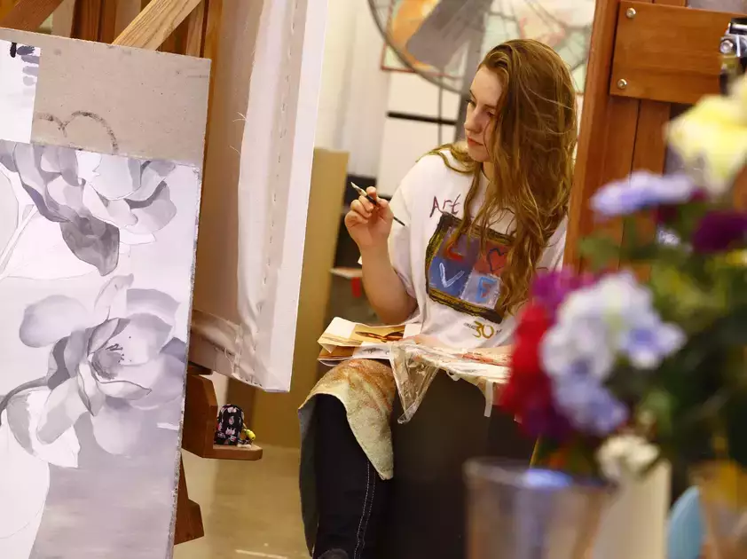 Students in a class taught by Professor Yolanda Sharpe work on the base layers of their oil paintings.