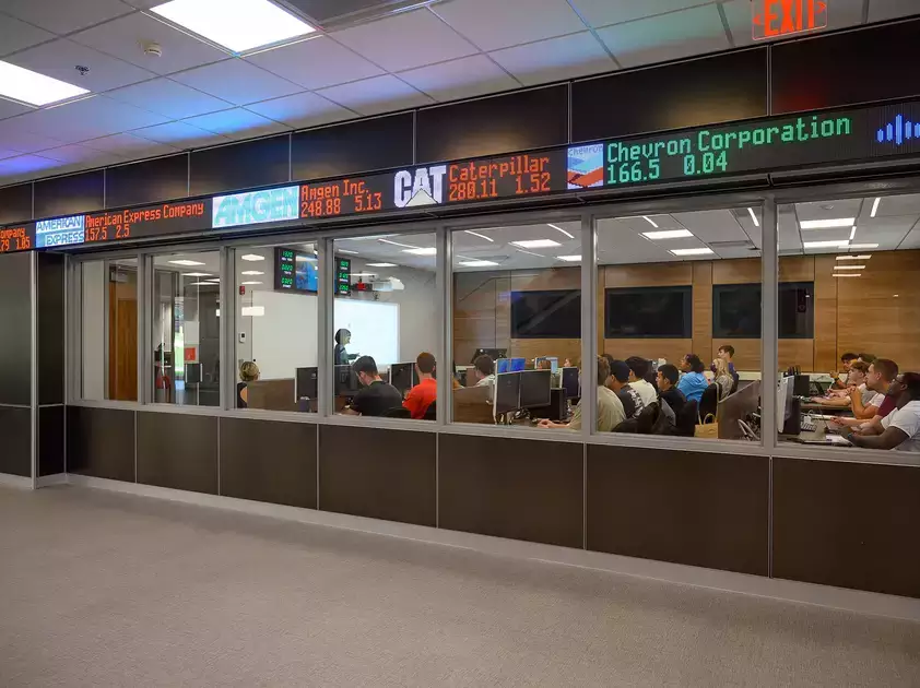 Stock ticker scrolls above the windows of the Bloomberg Room.