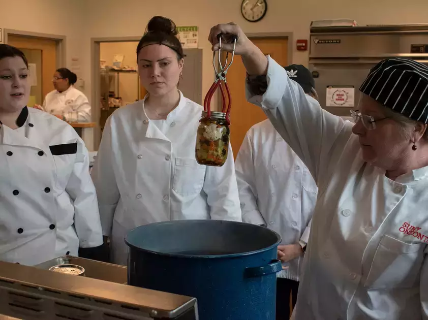 Students learn nutritional cooking techniques during Food Science lab.