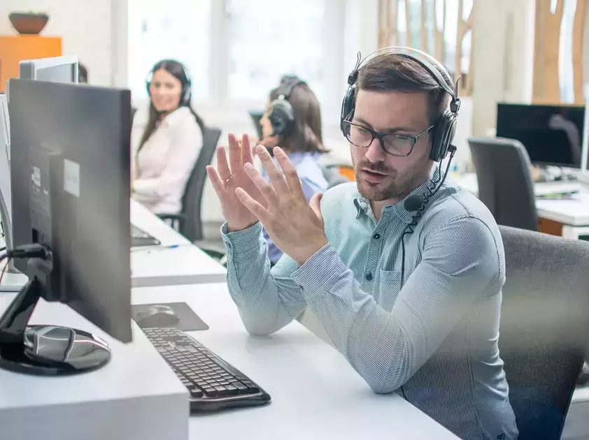 IT Customer support representative taking a call