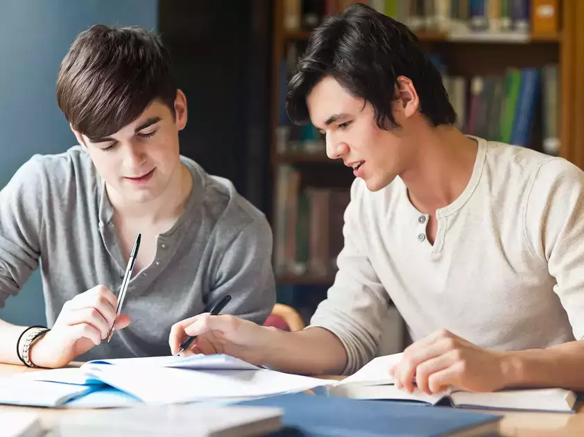 Individuals review material during a tutoring leadership course